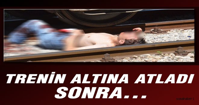 KENDİNİ TRENİN ALTINA ATTI 